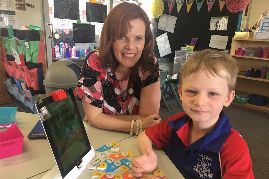 Oakleigh State School digital learning coordinator Nicola Flanagan with a student