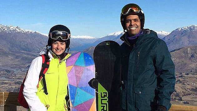 A woman and a man in ski attire