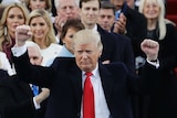 President Donald Trump pumps his fist after delivering his inaugural address
