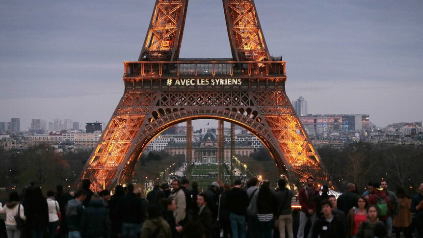 People gather at Eiffel tower in support of Syrian people