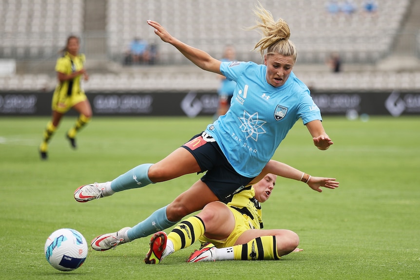 Remy Siemsen is tackled in A-League Women