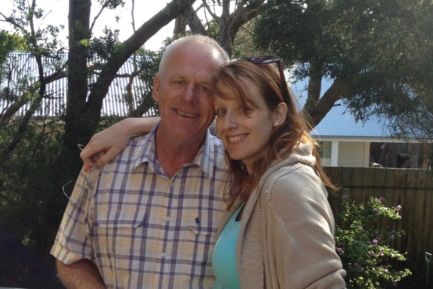 Kristin Cornell with her arm around her father Allan. 