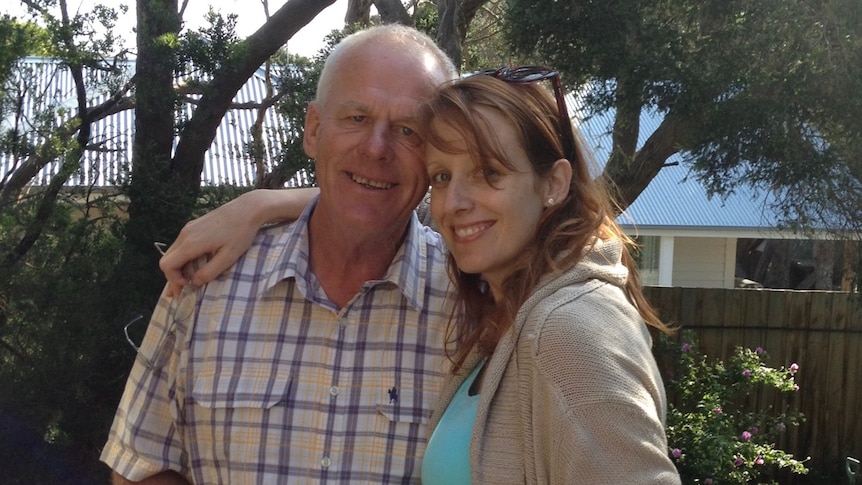 Kristin Cornell with her arm around her father Allan. 