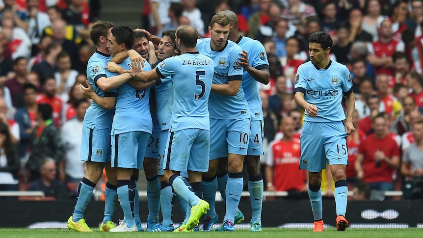 Manchester City celebrates Martin Demichelis' goal against Arsenal