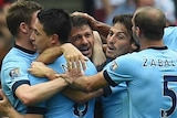 Manchester City celebrates Martin Demichelis' goal against Arsenal