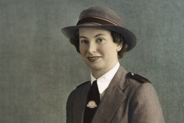 Vivian Bullwinkel, in army uniform, smiles as she poses for a formal portrait.