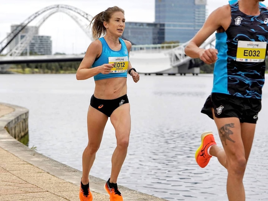 A woman wearing blue running