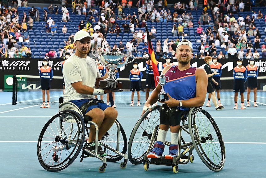 Sam Schroder and Dylan Alcott pose during the trophy presentation of the Quad Wheelchair Singles Final