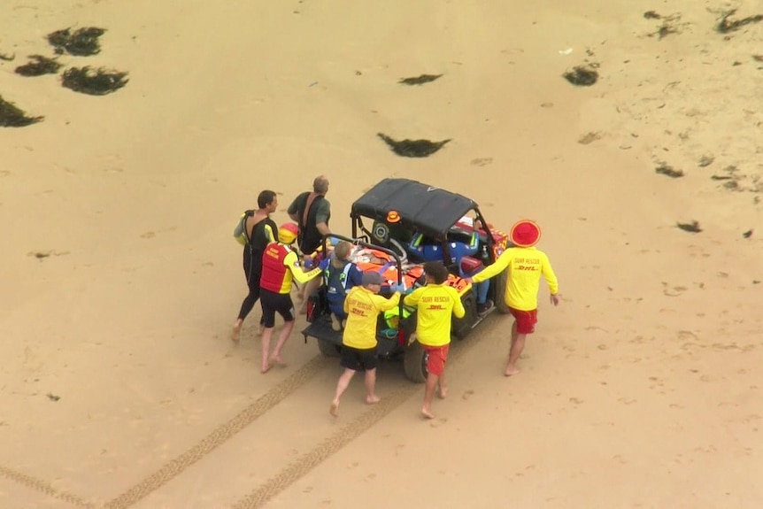 a vehicle on the beach transporting a patient