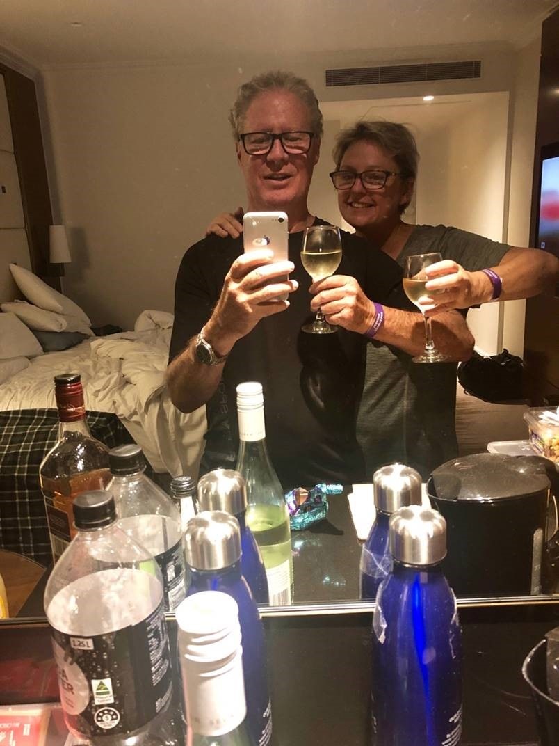 Jason and Larinda Hopton hold glasses of wine.