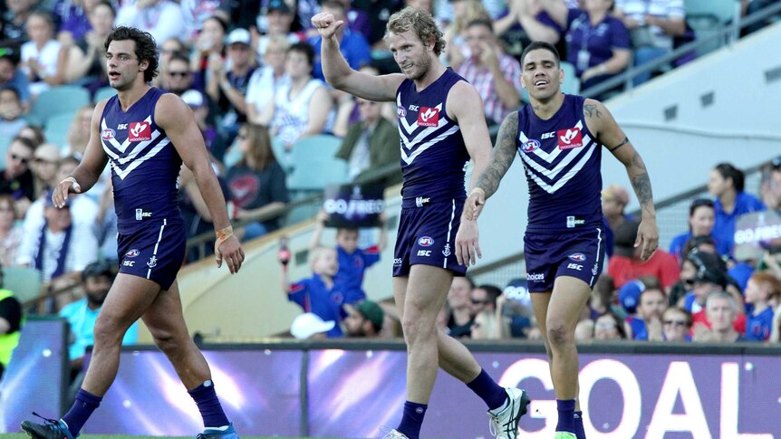 Fremantle's David Mundy (C) reacts to his goal against Essendon at Subiaco Oval on May 7, 2017.
