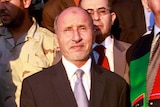 National Transitional Council (NTC) head Mustafa Abdul Jalil (C) arrives at Mitiga airport in Tripoli September 10, 2011.