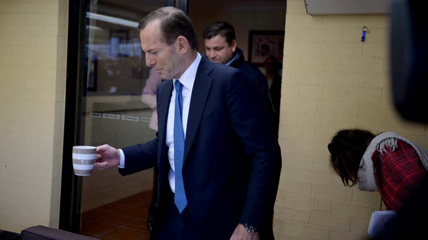 Tony Abbott has a cup of coffee