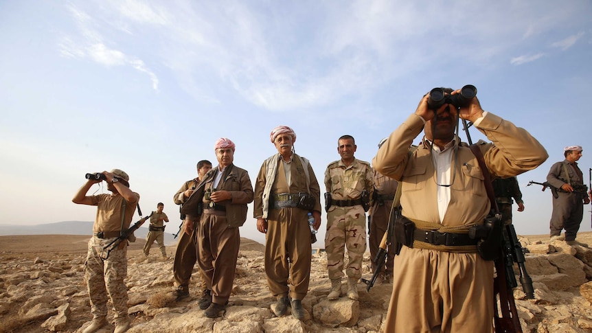 Kurdish Peshmerga forces fighting Islamic State (IS) insurgents near the town of Makhmur, south of Erbil, in August, 2014.