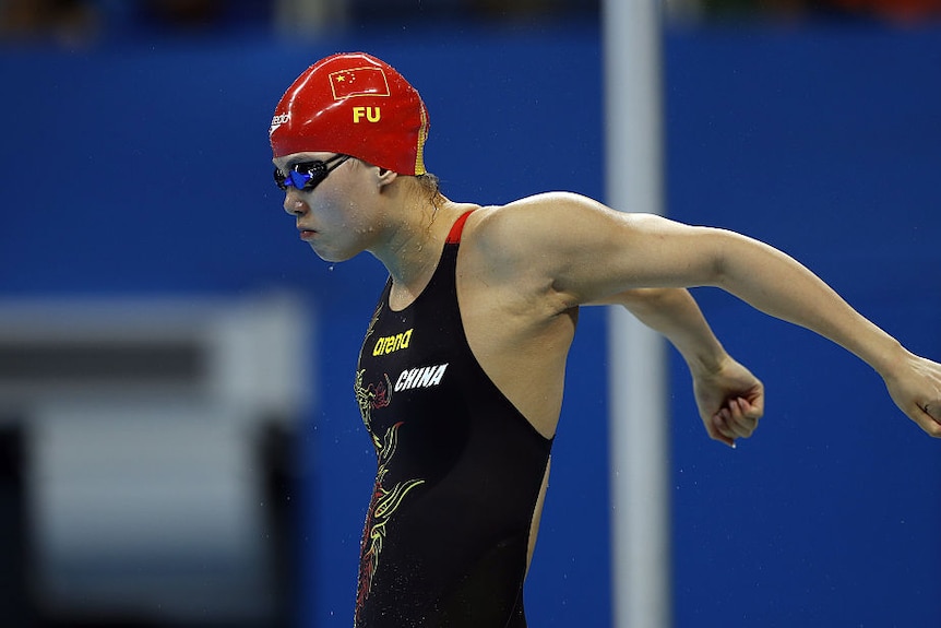 A Chinese swimmer warms up.