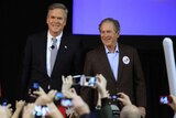 Jeb Bush stands with his brother George W on a stage at a campaign rally in South Carolina.