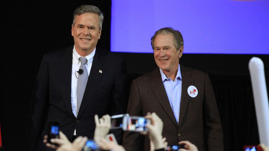 Jeb Bush stands with his brother George W on a stage at a campaign rally in South Carolina.