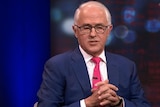 Malcolm Turnbull appears on Q+A wearing a navy suit and pink tie.