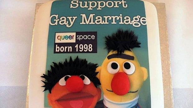 An image of the cake, featuring Sesame Street characters Bert and Ernie, which was baked by another business.
