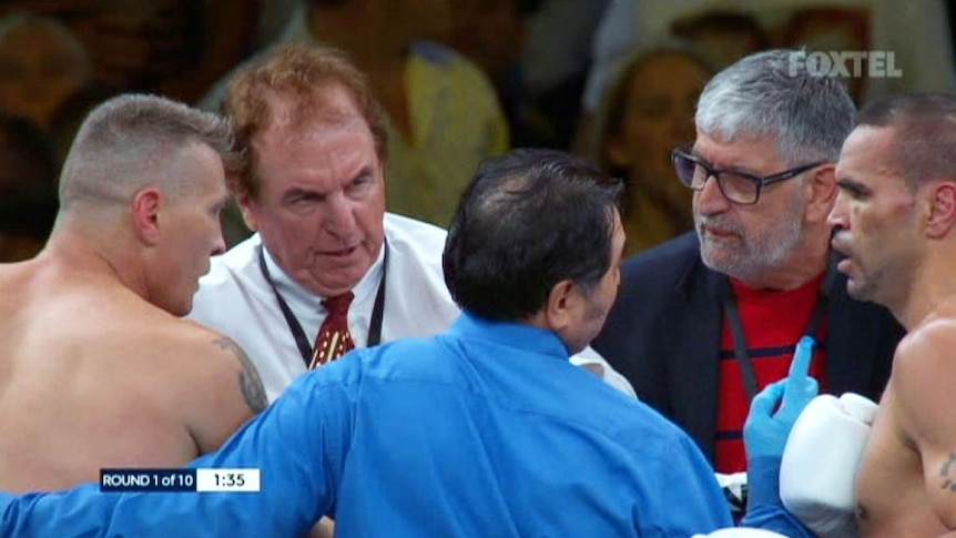 Boxers and officials including doctors in the ring at the Mundine-Green fight in Adelaide.