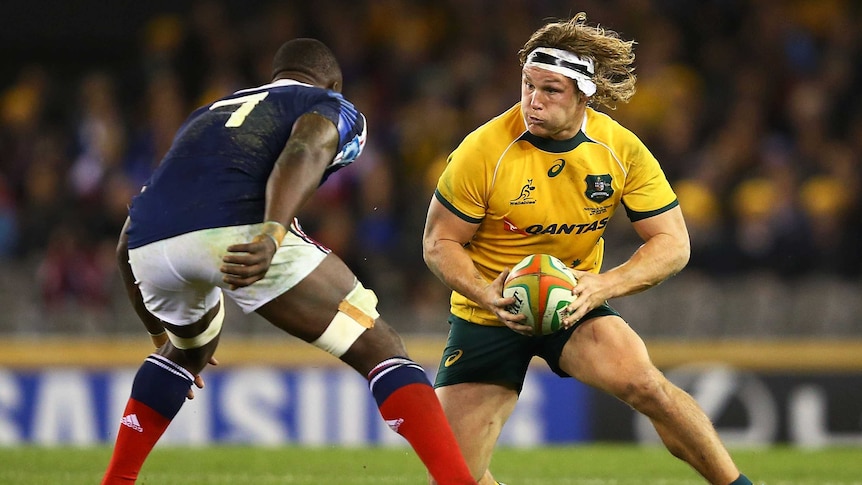 Tight contest ... Wallabies captain Michael Hooper meets the French defence