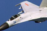 Chinese fighter jet flying close to a US navy plane