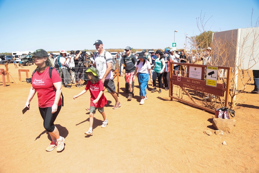 People walking in to climb Uluru