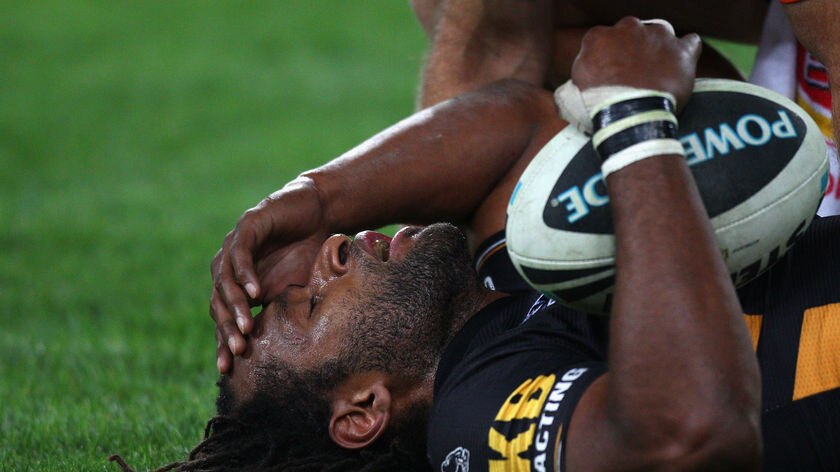 Pain of defeat ... Lote Tuqiri copped a knee in the ribs from Jeremy Smith late in the semi-final.