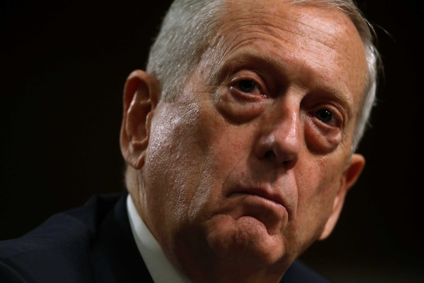 A close up of General James Mattis testifying before the committee