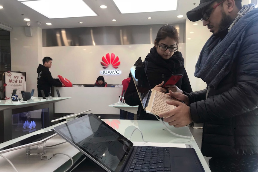 Shoppers view Huawei laptops in Beijing