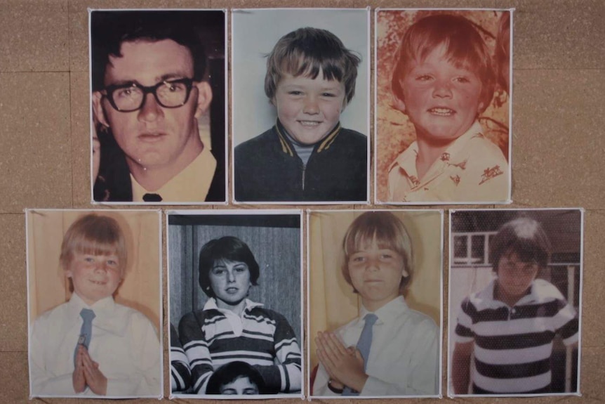 Portraits pinned on a corkboard