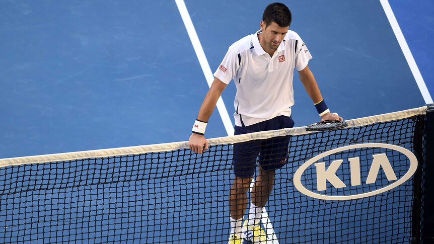 Serbia's Novak Djokovic gestures after winning over Gilles Simon at the Australian Open.