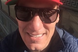 Cory Bernardi wearing a "Make Australia Great Again" hat.