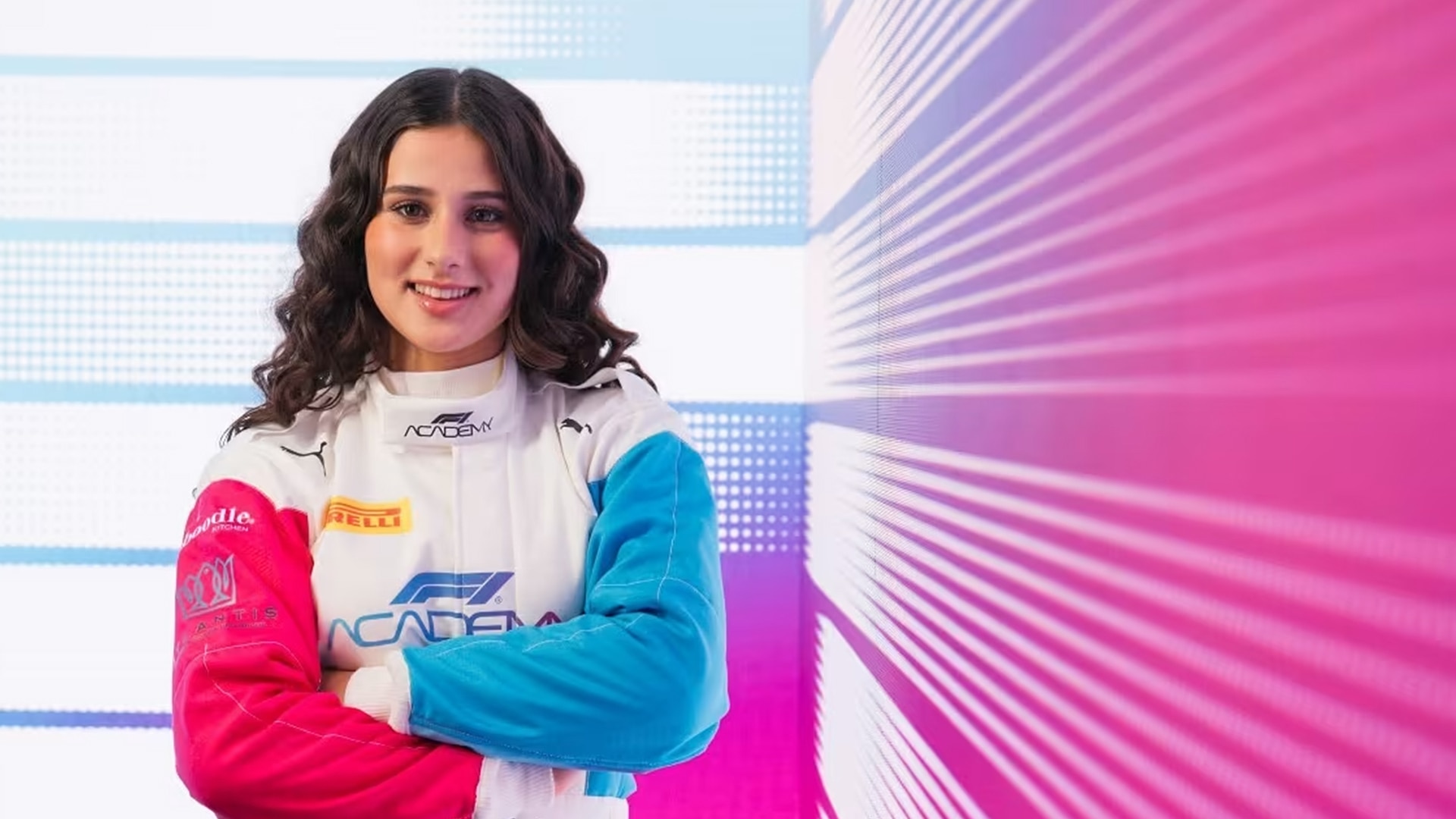 Joanne in racing gear smiling for a promo photo.