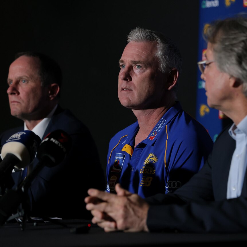 Adam Simpson sitting in between Don Pyke and Paul Fitzpatrick at a press conference.