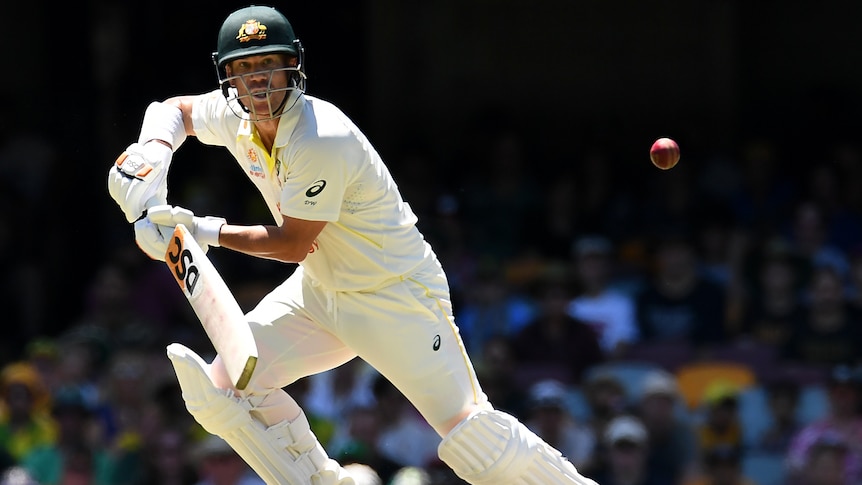 An Australia batter watches a shot as he begins to run during the first men's Ashes Test at the Gabba.