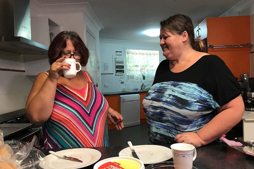 Sheree Bull (L) and Christie Brown (R) in a kitchen.
