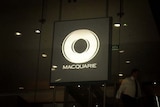 A Macquarie Bank sign sits in the window of one of the bank's Sydney offices