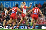 Callum Sinclair of the Swans (C) gestures after kicking a goal against St Kilda at the SCG.