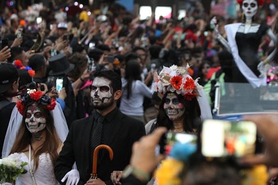 A crowd in Mexico celebrating Día de los Muertos (the Day of the Dead)