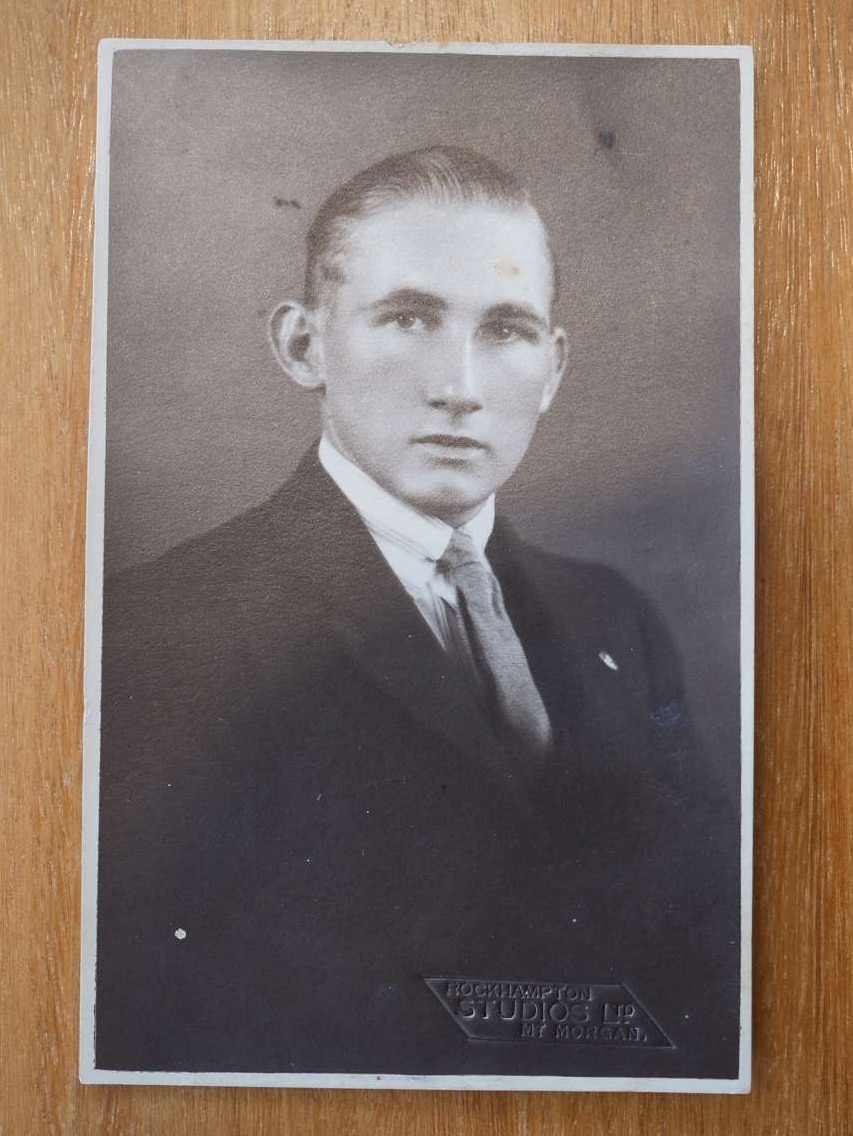 A black and white photo of a man.