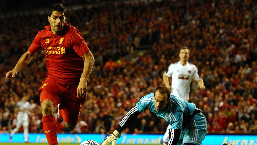 Liverpool forward Luis Suarez and Hearts goalkeeper Jamie McDonald during 2012 Europe League match.