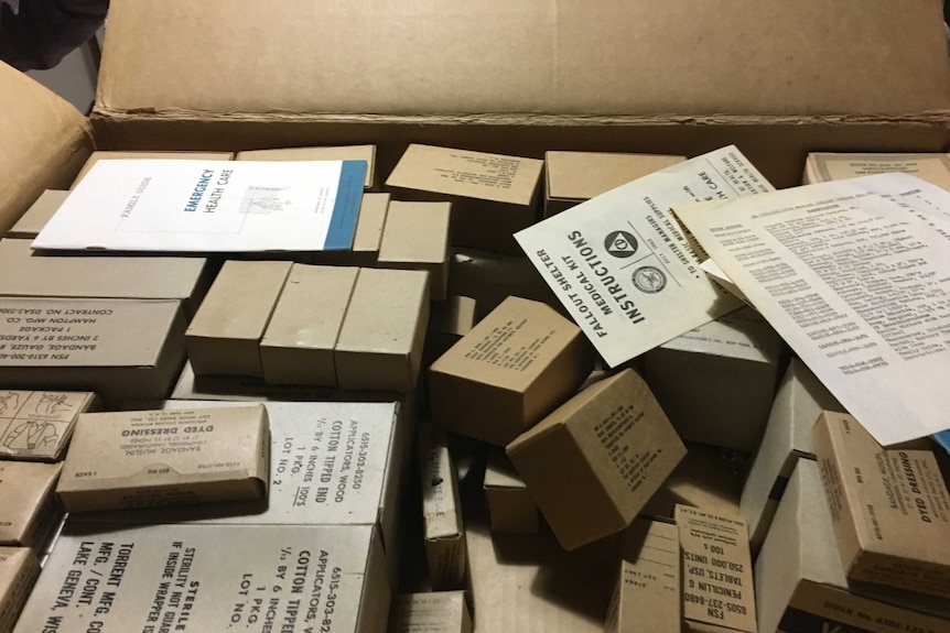 Pamphlets, soap in boxes inside old 1960 US medical kits