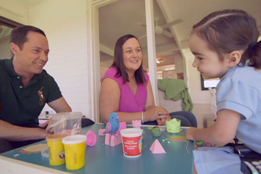 Joseph, Libby and Isabella Lombardo sitting at a table.