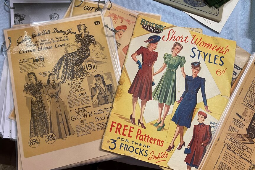 a selection of preserved older magazines and newspaper clippings used to sew clothing like dresses