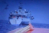 Still of video showing lifeboat being towed