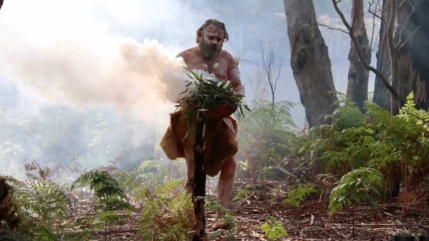 Jason Thomas conducting a smoking ceremony at the start of Reconciliation Week in Tasmania