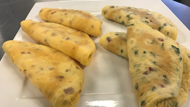 Several omelettes sit on the counter inside the Ipswich Sunny Queens factory