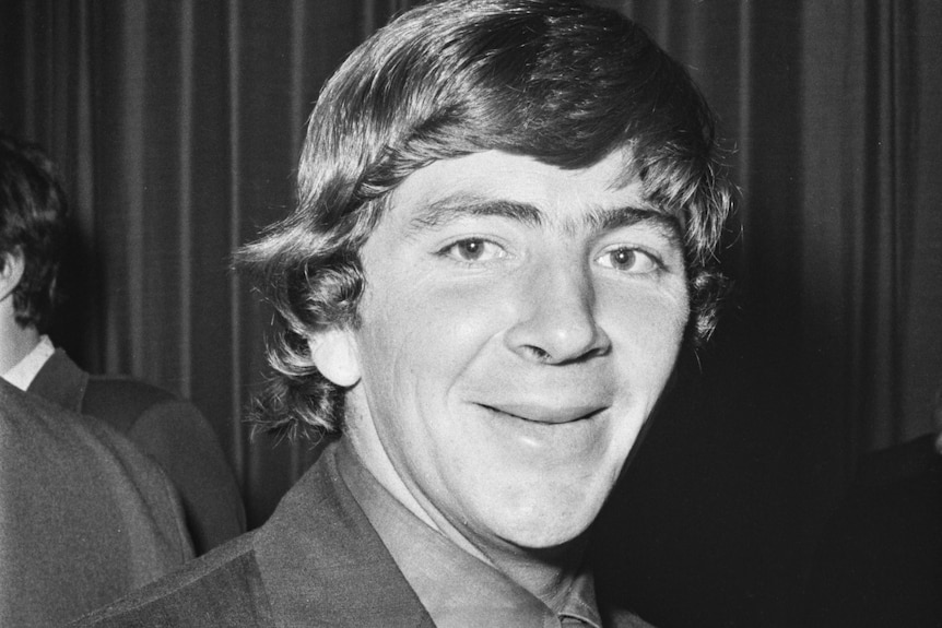 A young, clean-shaven Rod Marsh smiles