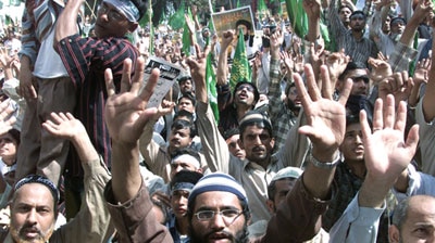 Tens of thousands of Pakistani Muslims have protested against cartoons of the Prophet Mohammed.